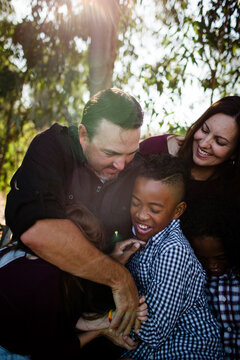 Family of Five Hugging & Laughing at Park in Chula Vista
