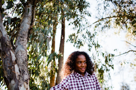 Young Boy Standing Next to Tree at Park in Chula Vista
