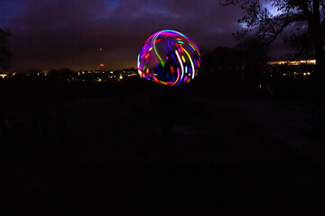 Silhouette Circus Model in Queens Park Bolton at Night in the Snow with Light Trails