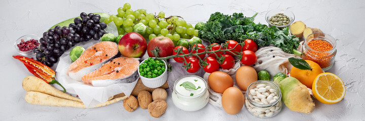 Selection of organic healthy products on gray background product.