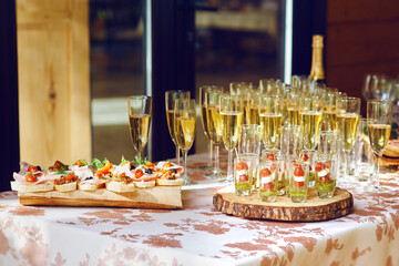 snacks and glasses of champagne. buffet table