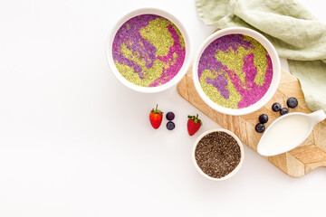 Colorful chia pudding in bowles for breakfast. Acai smoothies bowles
