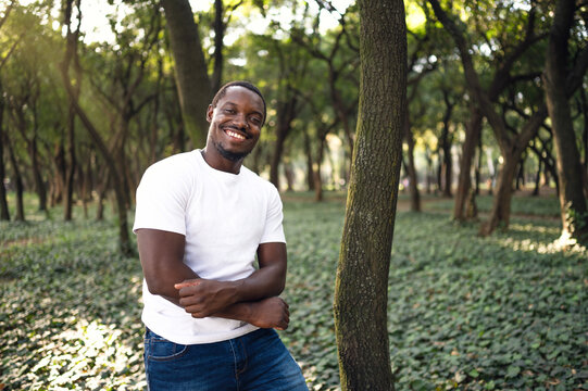 A young black man in park. Outdoor portrait of traveler.