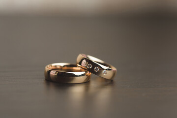 closeup of golden rings on table
