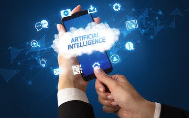 Female hand holding smartphone with ARTIFICIAL INTELLIGENCE inscription, cloud technology concept