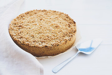 Freshly baked homemade double crutsed apple crumb pie on white background. Sweet food.