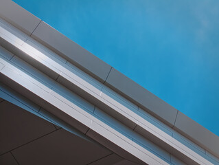 Low Angle View of White Building Facade Against Clear Blue Sky
