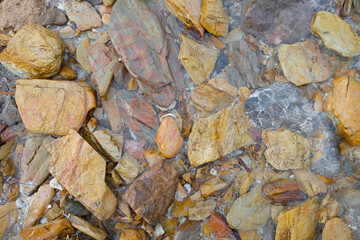 Closeup natural rock stone with mineral on walkway at beach