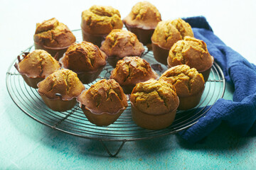 Healthy muffies with turmeric on a wire rack. Front View. Food concept.