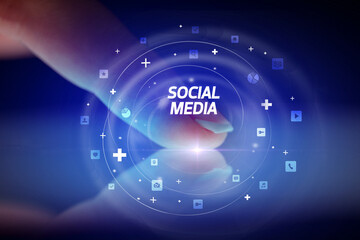 Finger touching tablet with social media icons and SOCIAL MEDIA