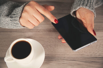 Plakat woman hand phone with coffee