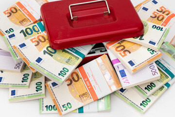 cash box with bundles of Euro banknotes