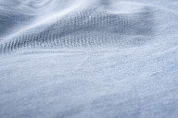 texture of rumpled and pleated blue denim