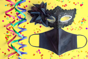 Máscara negra con serpentinas y mascarilla covid-19