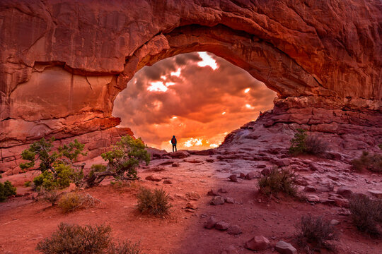 Enjoying the sunrise in the North Window Arch, Arches National Park Utah