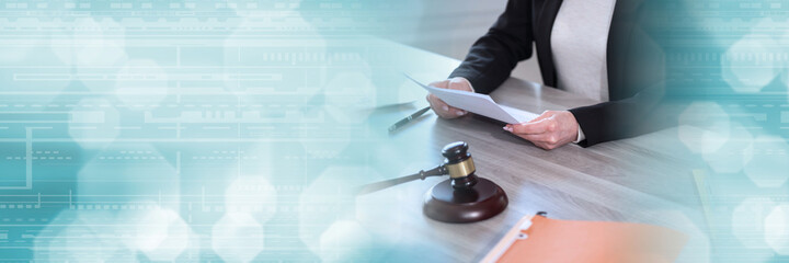 Female lawyer working on document; panoramic banner