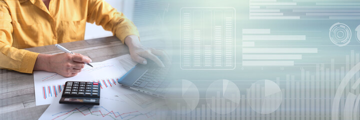 Accountant working on laptop; panoramic banner