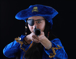portrait of a beautiful girl pirate on a black background