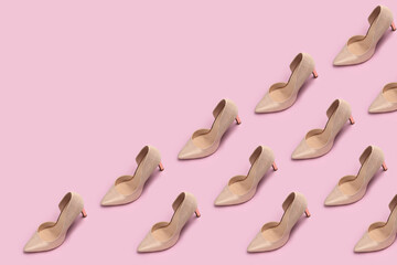Pattern of woman shoes heels isolated on pink background.