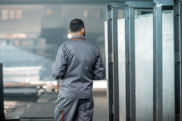Worker with a digital tablet at the plant