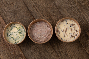 Different bread spreads in paper take away containers