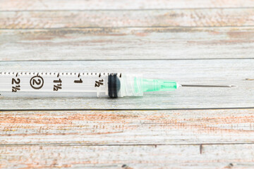 Hygienic Single-Use Disposable Syringe Injection On Wood Background