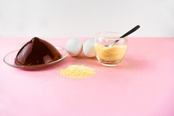 Jelly, gelatin and eggs are the main foods containing collagen, essential for youthful skin and healthy joints. Light pink background. Copy space.