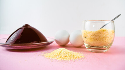 Jelly, gelatin and eggs are the main foods containing collagen, essential for youthful skin and healthy joints. Light pink background. Copy space.
