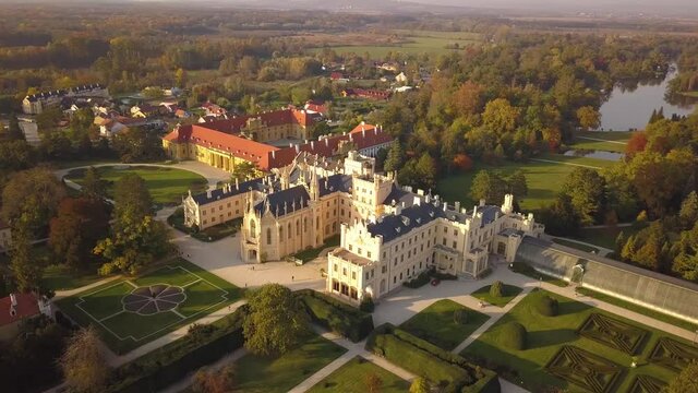 Aerial view of small town Lednice and castle yard with green gardens in Moravia, Czech Republic. UNESCO World Heritage Site.