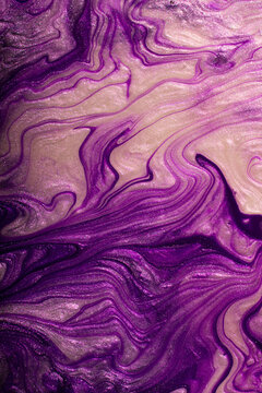 Abstract violet shimmer background.Make up concept.Beautiful stains of liquid nail laquers.Fluid art,pour painting technique.Good as digital decor,copy space.Vertical photography.