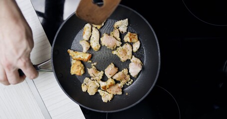 Preparing low fat fried chicken for dinner on induction plates