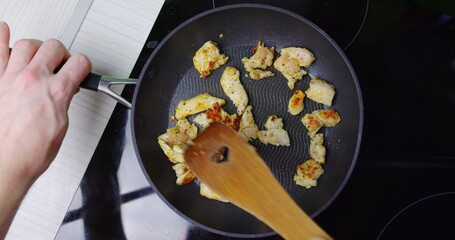 Preparing low fat fried chicken for dinner on induction plates
