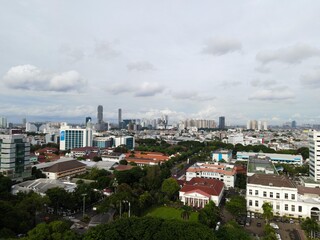 Fototapeta premium Aerial view of highway intersection and buildings in the city of Jakarta and noise cloud with Jakarta cityscape. JAKARTA - Indonesia. January 30, 2021