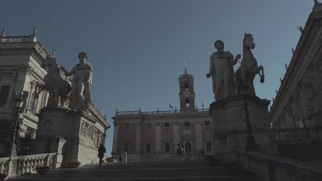 Pan left on beautiful Cordonata Staircase designed by Michelangelo to lead at Campidoglio Square on on homonymous hill in city downtown seat of City Hall museums a tourist actraction