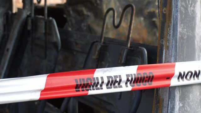 Firefighter italian  signal " Vigili del fuoco "brings safety after a fire - interior truck burned in the street after a fire 
