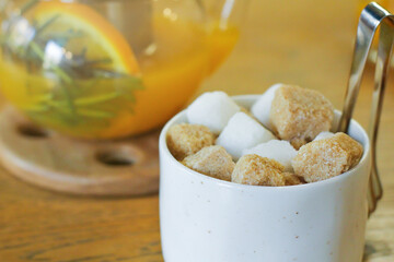 sugar bowl with different types of lump sugar cane and white