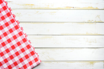 Rustic Italian cooking template - top view of vintage wooden table with a red checked tablecloth...
