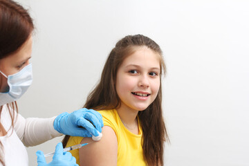 doctor and patient. Vaccination concept. Female doctor vaccinating cute little girl