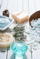 skin care, hygiene products with lavender leaves on white wood table