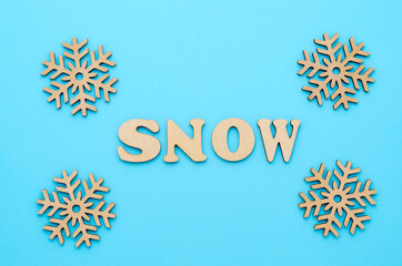 New Year or winter composition. Pattern of snowflakes on a pastel blue background. Christmas, winter, new year concept. Flat lay, top view, copy space.