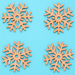 New Year or winter composition. Pattern of snowflakes on a pastel blue background. Christmas, winter, new year concept. Flat lay, top view, copy space.