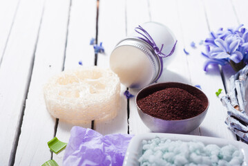 bath salt with hyacinth flowers on white wooden background