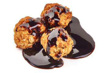 Homemade oat cookies with chocolate syrup, isolated on white background