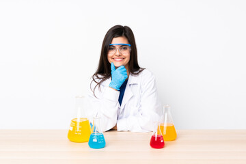 Young scientific woman in a table with glasses and smiling