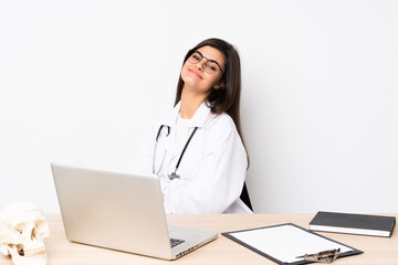 Professional traumatologist in workplace laughing