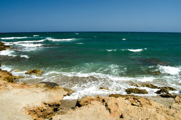 Fototapeta na wymiar coast and sea, waves crashing against rocks, Gouves, Crete, Greece