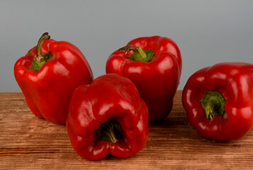 red bell pepper on gray background, food preparation process, proper nutrition