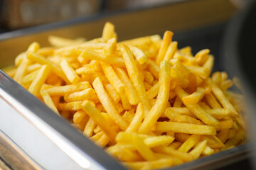 Pile of French fries in the food court tray. Street food. Fast food