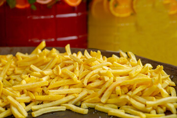 Pile of French fries in the food court tray. Street food. Fast food