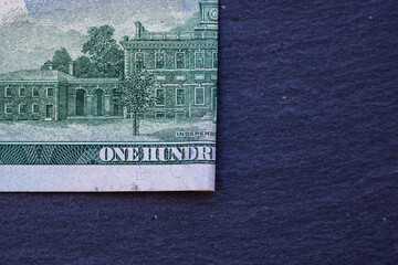 Selective focus on detail of 100 dollars banknote. Close up macro detail of money banknotes,...